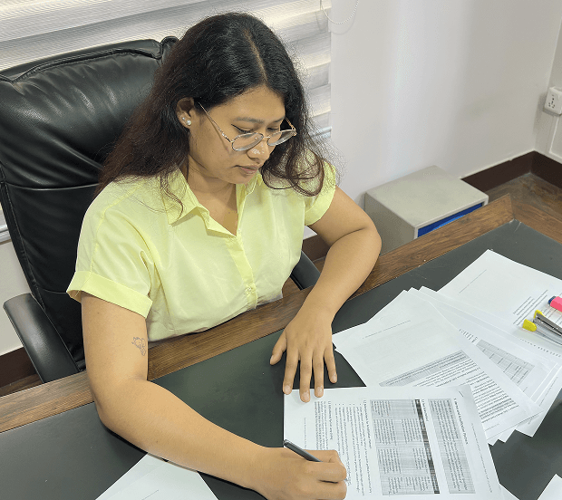 Grant Application — person reviewing documents